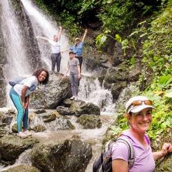 Students at waterfall in jungle