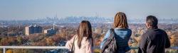 students looking over view of NYC skyline