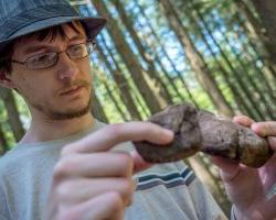 student comparing rocks