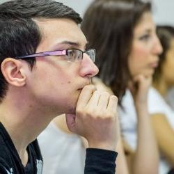 Image of a student listening in class.