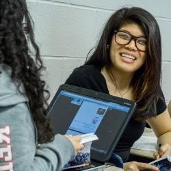 Student smiling in a poetry class.