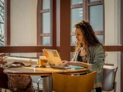 A student on their laptop looking into making a service request.