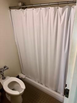 The bathroom in a Single Room in Blanton Hall with a shower.