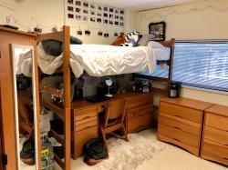 Another side of the room in a Triple in Blanton Hall with a bunk bed and a desk underneath.