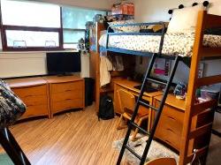 A Triple Unit in Stone Hall showcasing another angle of the bunk bed with the desk underneath the top bunk.