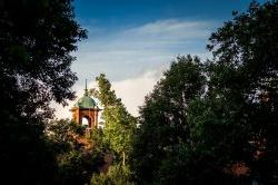 Image of the College Hall belltower at dusk.