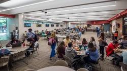 Inside of the Student Center cafeteria with students sitting at the tables