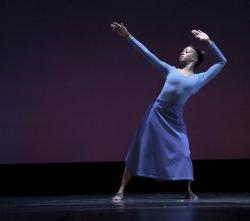 Photo of female dancer in reclined pose.